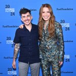 Article Banner - Sophia Bush, wearing a floral suit, stands with Chase Strangio, wearing a navy short-sleeve button-up and grey pants, in front of a background with the Ford Foundation and Free Future 2024 logos.
