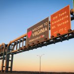 Article Banner - A set of highway signs centering one that reads "welcome to Virginia" with a heart.