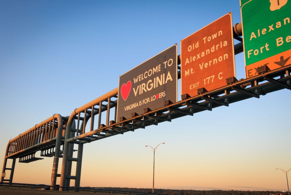 Article Banner - A set of highway signs centering one that reads "welcome to Virginia" with a heart.