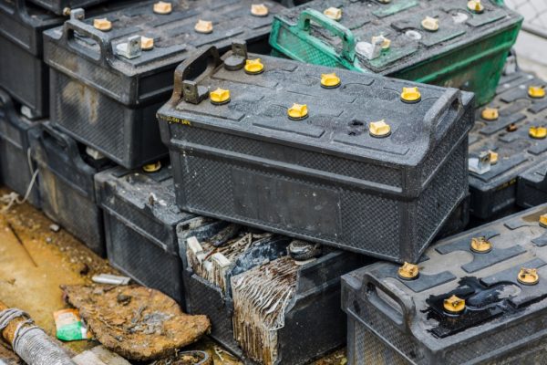 Discarded car batteries piled up, toxic waste