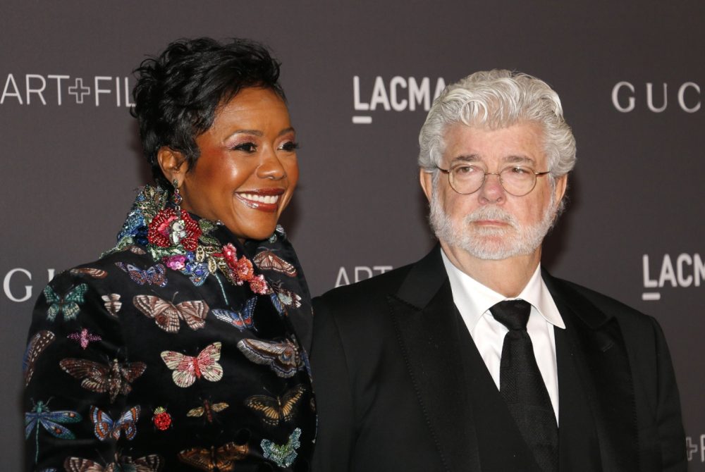 Mellody Hobson and George Lucas at a red carpet event.