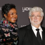 Mellody Hobson and George Lucas at a red carpet event.